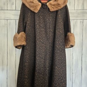 Mink trimmed brocade coat